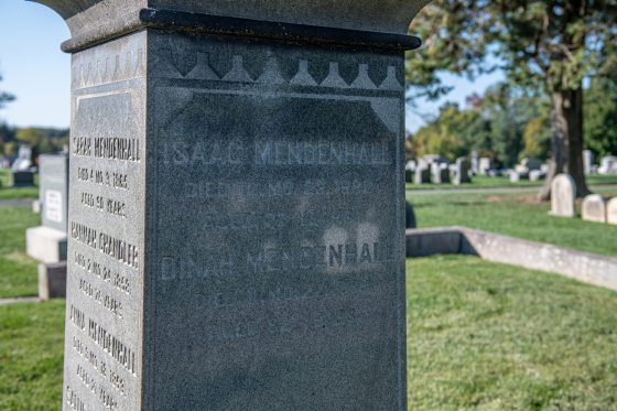 a close up of a stone cemetery marker 